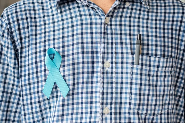 November Prostate Cancer Awareness month, Man in blue shirt with