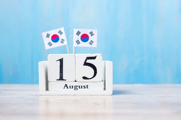 Wooden calendar of August 15th with miniature  Republic of Korea flags. independence day, National Liberation Day of Korea, Nation holiday Day and happy celebration concepts