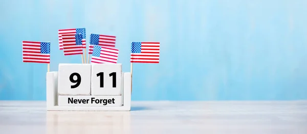 911 Never Forget with United States of America flag on wood background. copy space for text. Patriot Day and Memorial concept