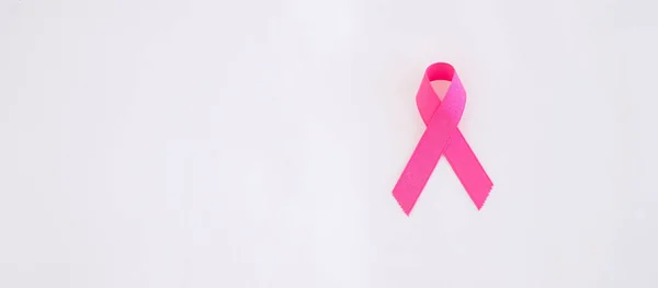 October Breast Cancer Awareness month, adult Woman  hand holding Pink Ribbon for supporting people living and illness. International Women, Mother and World cancer day concept