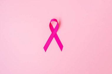 Ekim Kanser Farkındalığı Ayı, pembe arka planda Pembe Kurdele Yaşayan ve Hastalıkları Desteklemek İçin. Uluslararası Kadınlar, Anne ve Dünya Kanser Günü Konsepti