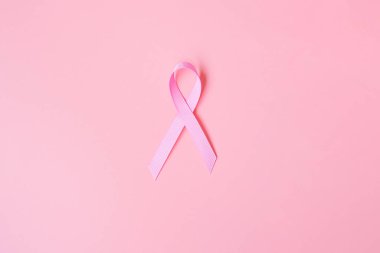 Ekim Kanser Farkındalığı Ayı, pembe arka planda Pembe Kurdele Yaşayan ve Hastalıkları Desteklemek İçin. Uluslararası Kadınlar, Anne ve Dünya Kanser Günü Konsepti