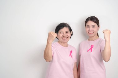 Pembe Ekim Kanser Bilinci ayı için pembe kurdeleli çift, Mayıs Kadın Sağlığı, Kasım Doğum Ebeveynleri Evlat Edinme, Kadın Hakları, Yetkilendirme, Mart Uluslararası Kadınlar Günü ve Kanser Günü