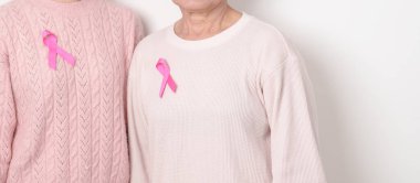 Pembe Ekim Kanser Bilinci ayı için pembe kurdeleli çift, Mayıs Kadın Sağlığı, Kasım Doğum Ebeveynleri Evlat Edinme, Kadın Hakları, Yetkilendirme, Mart Uluslararası Kadınlar Günü ve Kanser Günü