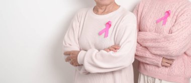 Pembe Ekim Kanser Bilinci ayı için pembe kurdeleli çift, Mayıs Kadın Sağlığı, Kasım Doğum Ebeveynleri Evlat Edinme, Kadın Hakları, Yetkilendirme, Mart Uluslararası Kadınlar Günü ve Kanser Günü