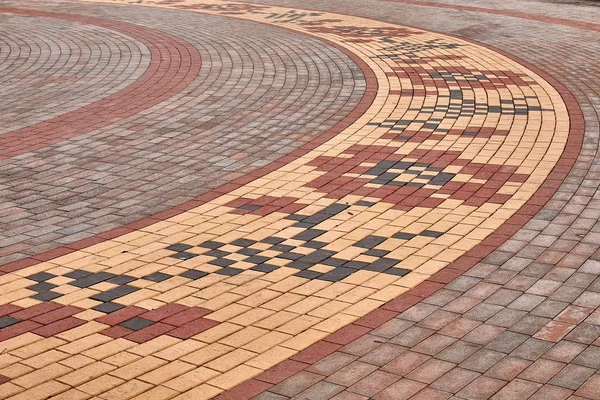 flowers from paving slabs laid out in an arc in the Ukrainian style close up