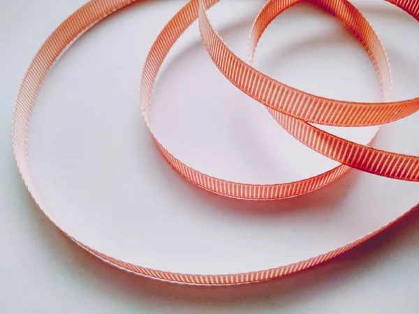 Orange Ribbon Coiled Rings White Background Close — Stock Photo, Image