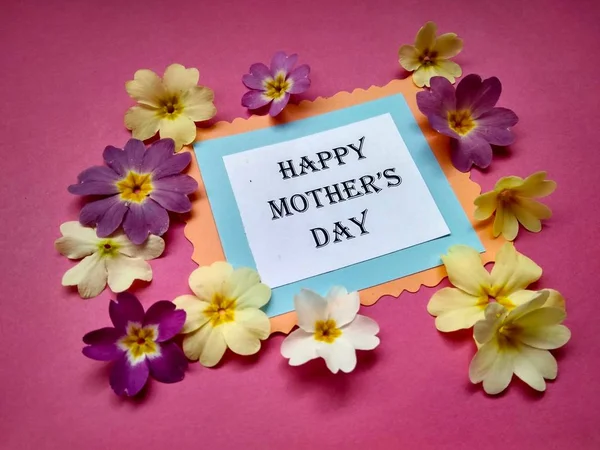 for Mother\'s Day holiday the inscription on paper and color flowers