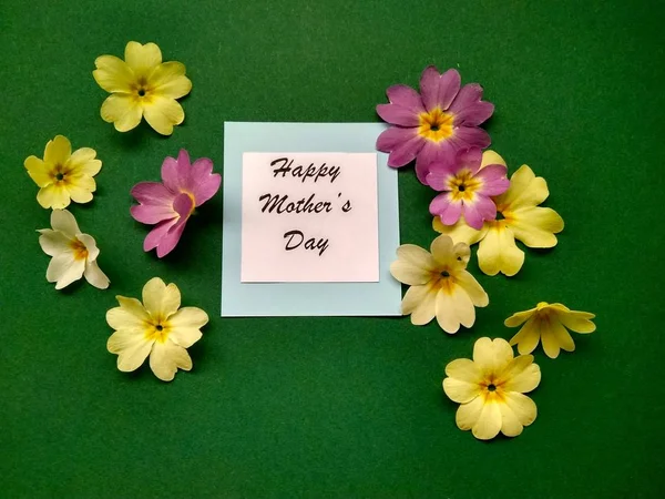 for Mother's Day holiday the inscription on paper and color flowers