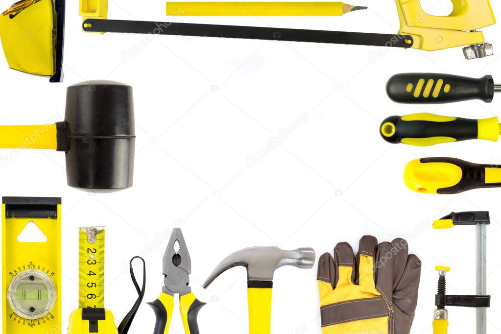 Construction tools collection on white background in form of fra