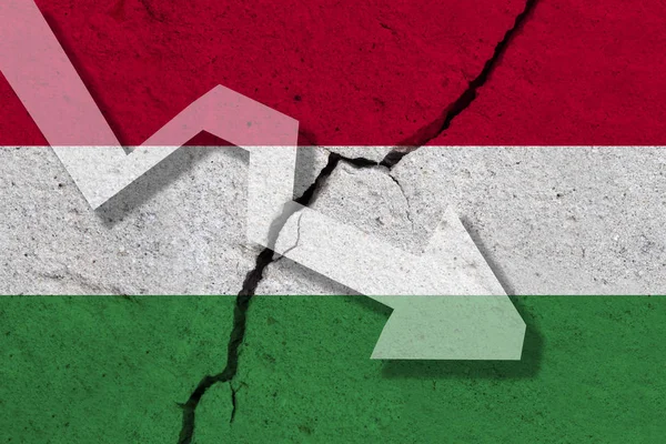 Hungary Flag on the cracked wall with arrow falling down. Concep