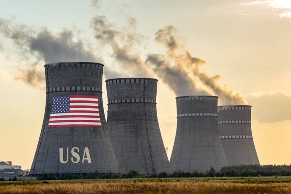 Nuclear plant chimneys with flag of USA ans country name text. E