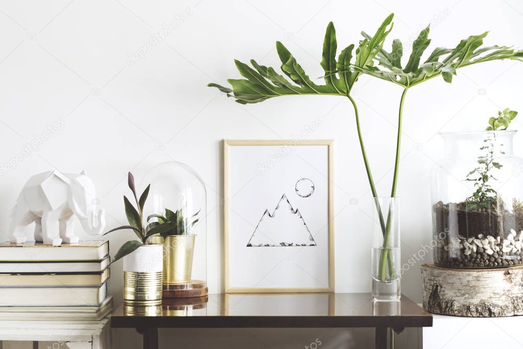 The stylish interior with mock up poster frame, plants, books, leafs and elephant sculpture. The retro concept of space. 