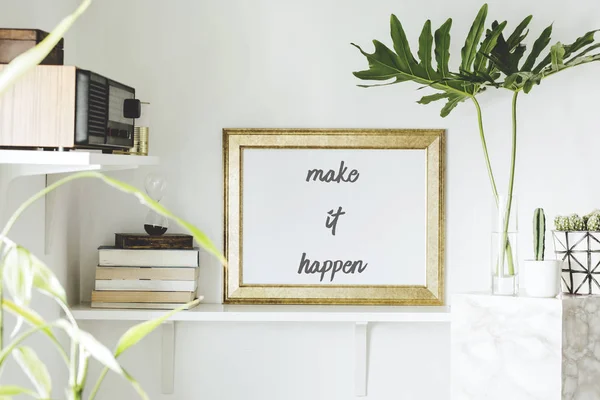 Bright white interior corner with shelves and inspirational phrase in frame on wall
