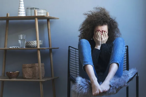 Deprimida Joven Rizado Mujer Sentado Silla —  Fotos de Stock