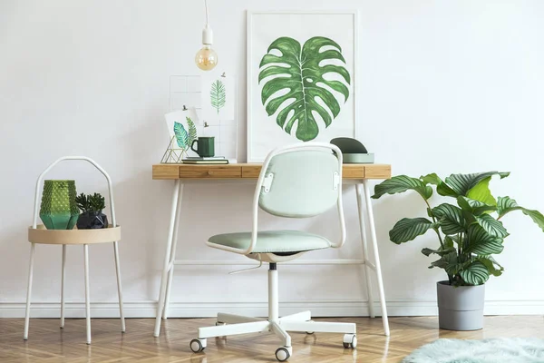 White stylish workplace with botanical art sketches on wall