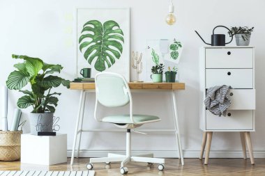 White stylish workplace with botanical art sketches on wall clipart