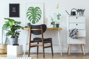 White stylish workplace with botanical art sketches on wall clipart