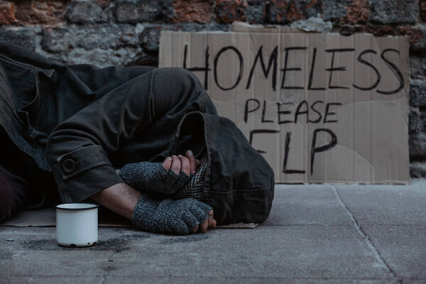 Close view of poor man asking for handout on street 