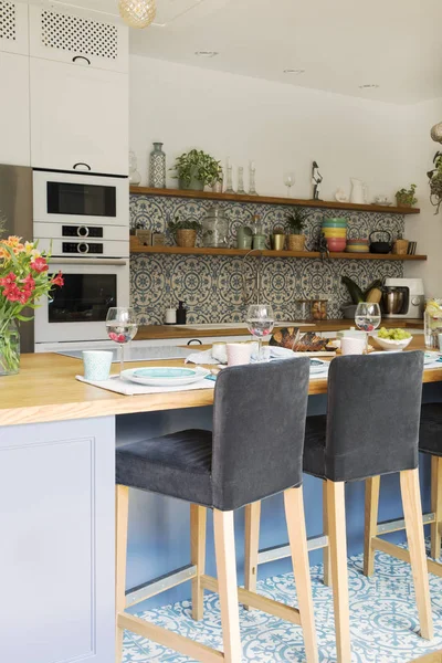 Light stylish kitchen in blue colors in Mediterranean style