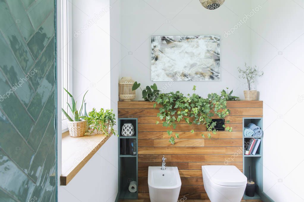 Close view of blue vanity unit in white stylish bathroom