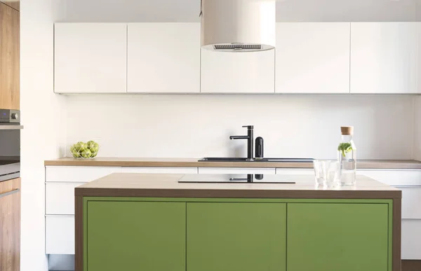 Stylish and modern white and green kitchen interior