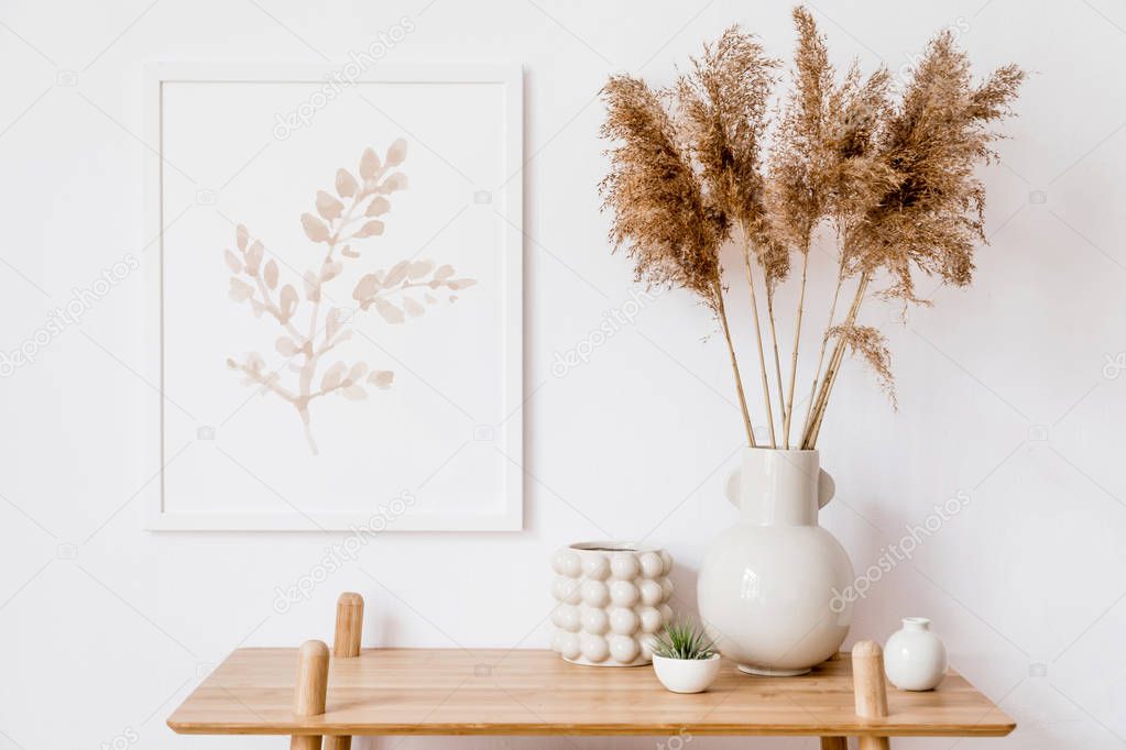 Stylish korean interior of living room with white mock up poster frame, elegant accessories, air plant, wooden shelf and vase with flowers. Minimalistic concept of home decor. Template. Bright room.