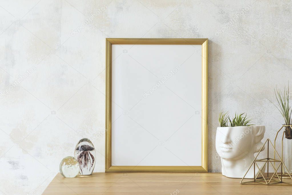 Modern and eclectic room interior with abstract wiped walls, gold mock up frame head sculpture, glassy balls and plants .Stylish space with design accessories. Eclectic home decor. Real photo. 