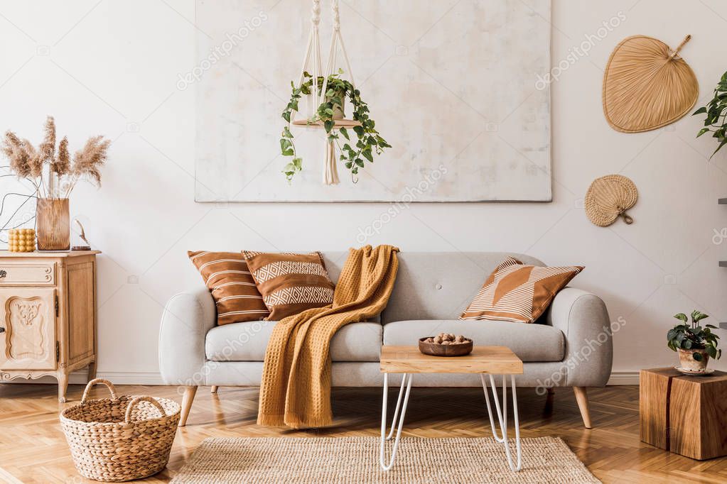 The design boho interior of living room in cozy apartment withh  elegant personal accessories. 