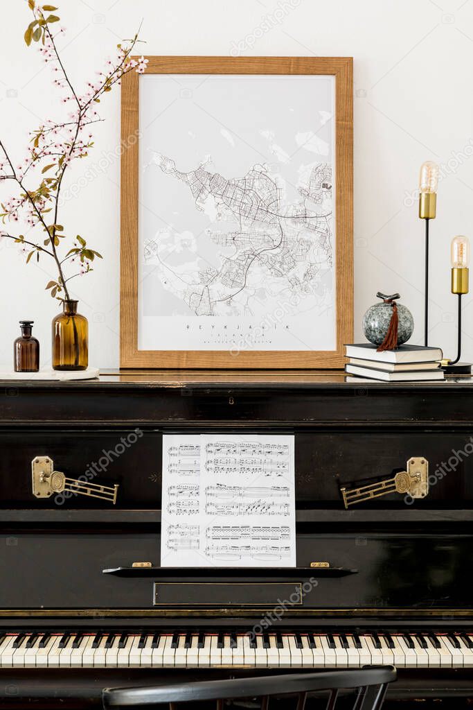 Luxury composition at living room interior with black piano, mock up poster map, spring flowers, books, design lamp and elegant presonal accessories in modern home decor.