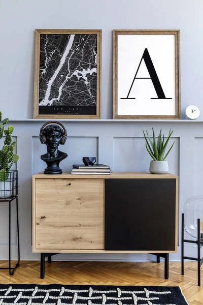 Scandinavian home interior of living room with two mock up poster frames, wooden commode, clock, plants, decoration, carpet and elegant accessories in stylish home decor.