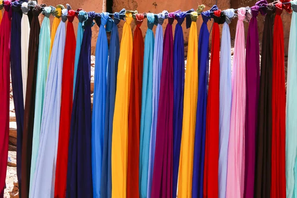 Colorful cloths drying in the sun — Stok fotoğraf