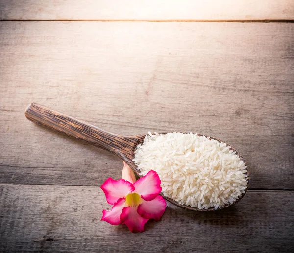 Rice Wooden Spoons Wooden Background Pink Flower Still Life — Stock Photo, Image