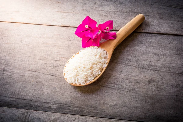 Rice Wooden Spoons Wooden Background Pink Flower Still Life — Stock Photo, Image