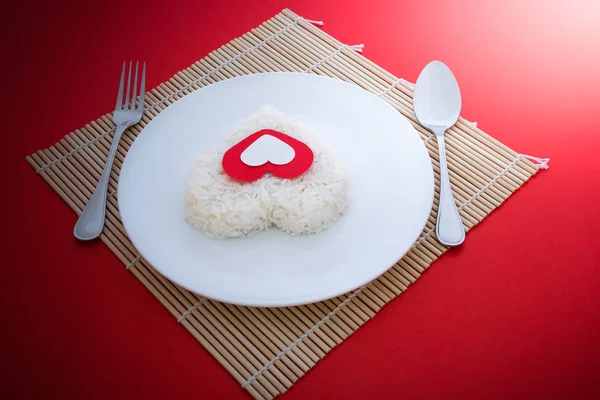 Cooked Rice Heart Shapes Spoon Fork White Dish Platemat Red — Stock Photo, Image