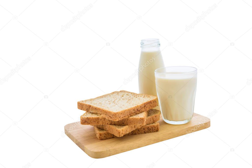 glass of milk and whole wheat bread on white background with clipping path