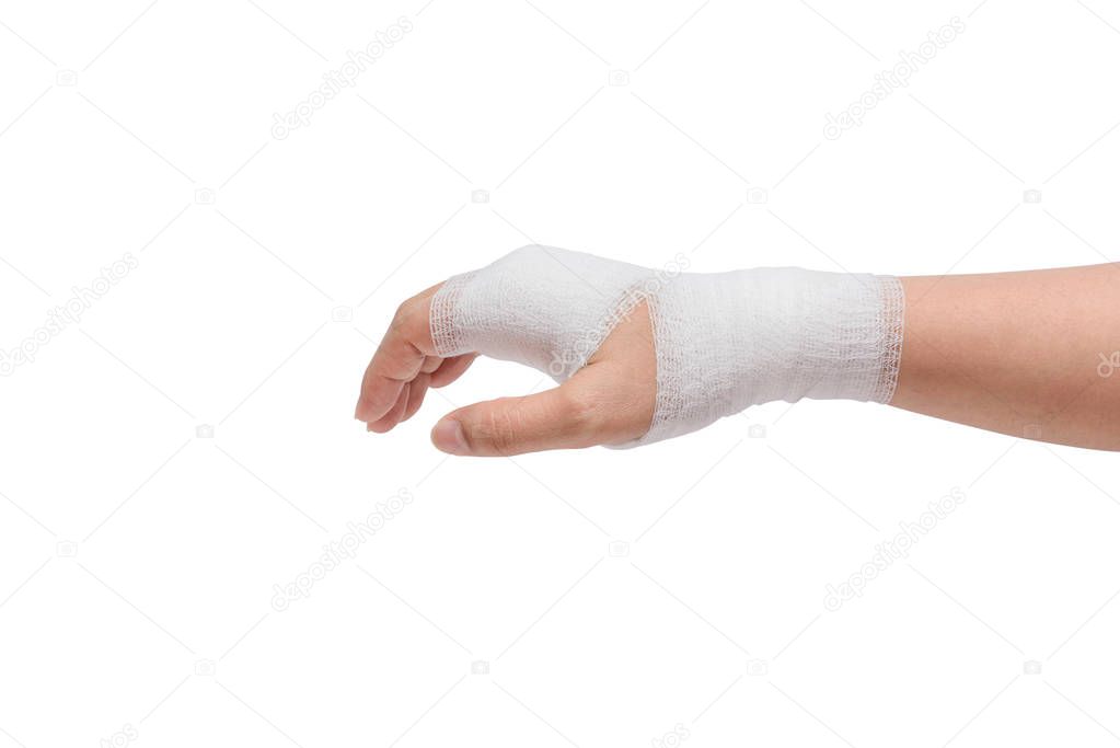 Injured painful hand with white gauze bandage. isolated on white background with clipping path