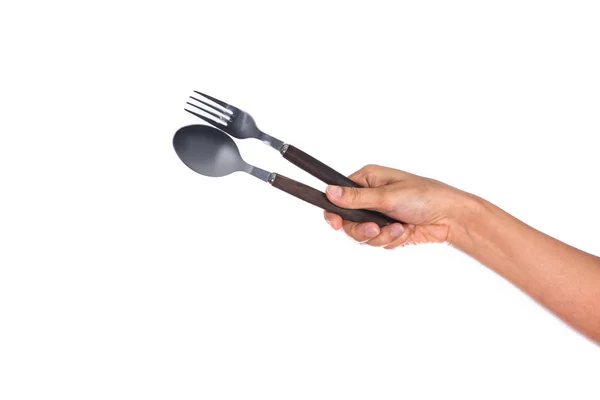 叉子和勺子举行由妇女的手隔绝在白色背景 — 图库照片