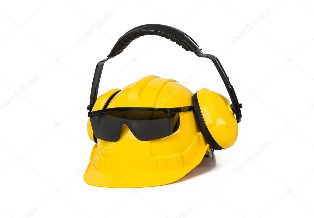 Hard hat, goggles and ear muffs isolated on white background