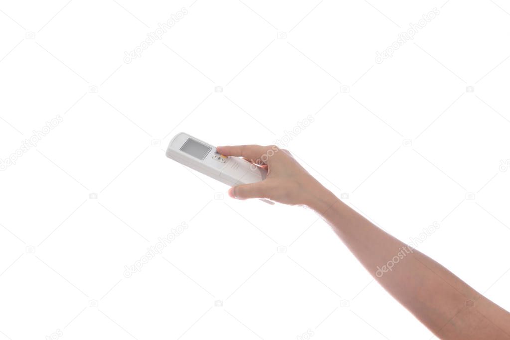 Woman Hand with remote control air conditioner isolated on white background