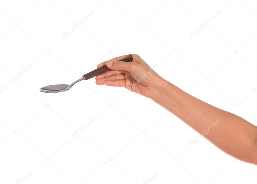 Woman hand holding an empty spoon, composition isolated over on the white background with clipping path