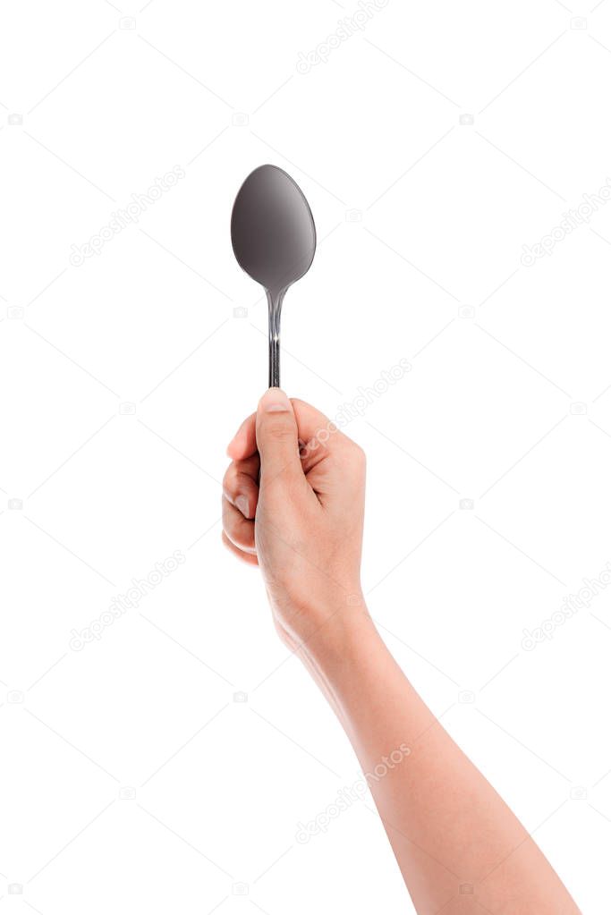 Woman hand holding an empty spoon, composition isolated over on the white background with clipping path