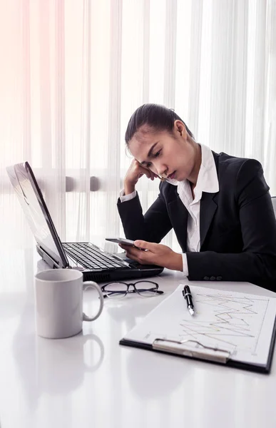 Businesswoman using computer in the office. Stress in the office