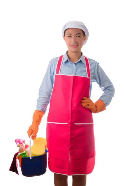 Happy woman holding a bucket full of cleaning supplies isolated — Stock Photo, Image