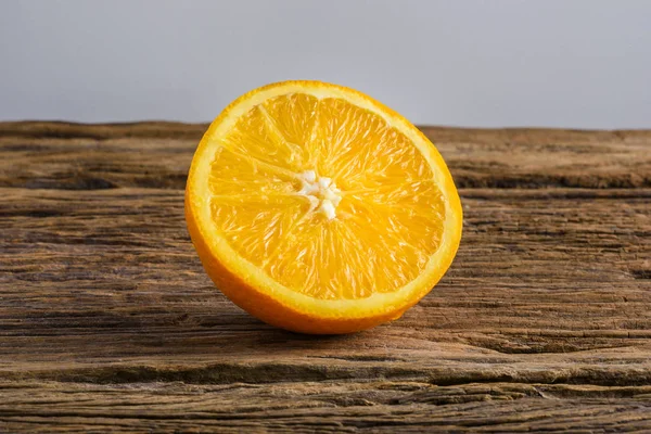 Still Life Half crescent Fresh Orange Fruit on Vintage grunge Wo — Stock Photo, Image