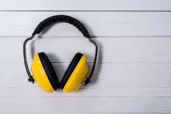 Yellow Protective ear muffs — Stock Photo, Image