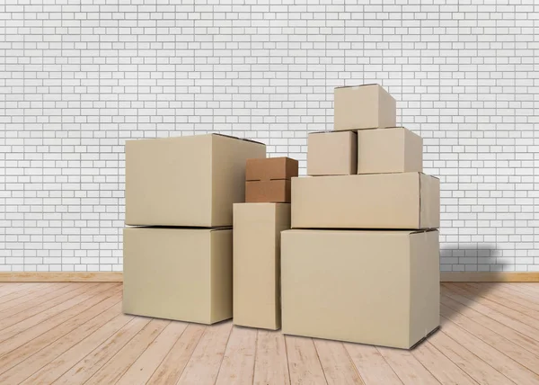 Me mudo a un nuevo hogar. Habitación vacía con cajas de cartón — Foto de Stock