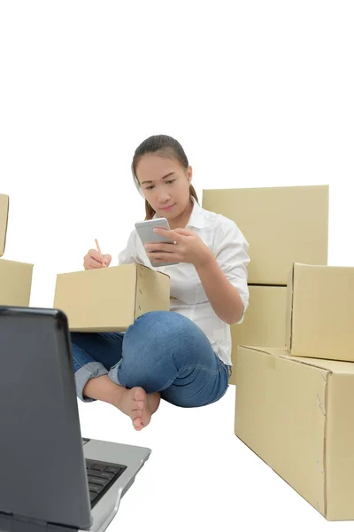 teenager owner business woman work at home with smartphone, lapt