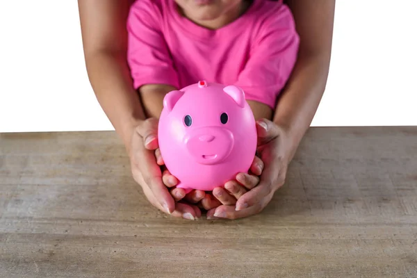 Mother and daughter hand holding piggy bank isolated on white ba — Stock Photo, Image