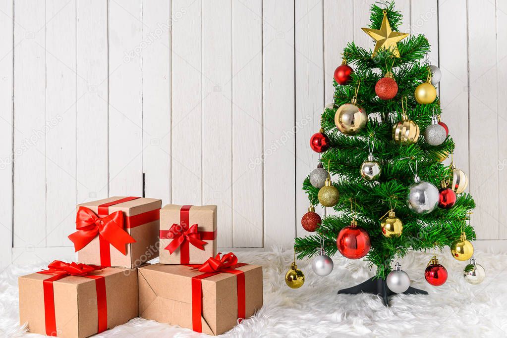 Christmas tree and ornaments with gifts boxes